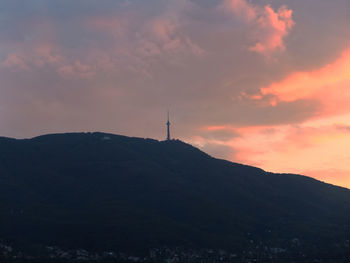 Scenic view of landscape against cloudy sky