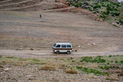 Car on road amidst field