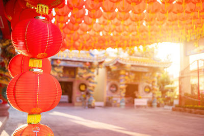 Illuminated lanterns hanging outside building