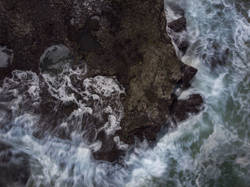 Scenic view of water flowing through rocks