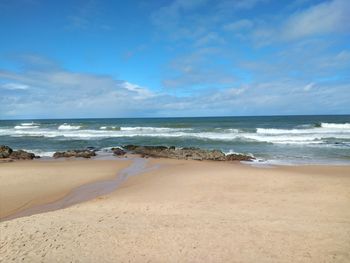 Scenic view of beach against sky