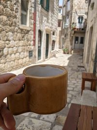 Close-up of hand holding coffee