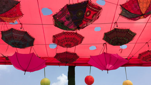 Low angle view of lanterns hanging in traditional building