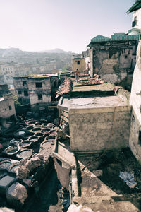 Buildings in city against clear sky