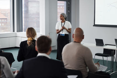 Woman having presentation during business meeting