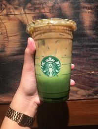 Close-up of hand holding drink