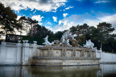 Statue of building against cloudy sky