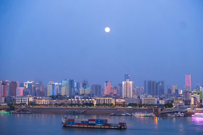 Aerial view of river and buildings against sky