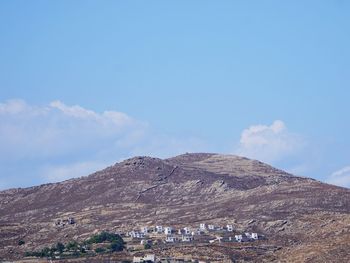 Scenic view of mountain against blue sky
