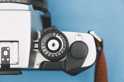 Close-up of camera on blue background