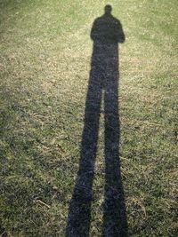 Shadow of person on grass