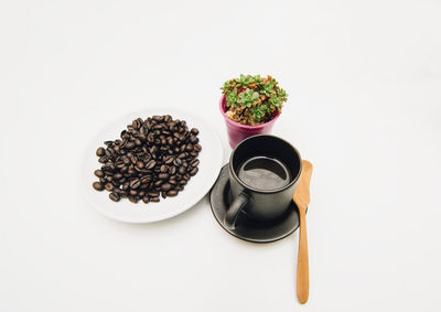 High angle view of coffee on table against white background