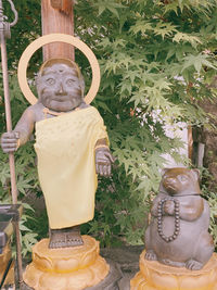 Close-up of buddha statue in yard