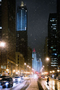 Illuminated city street at night