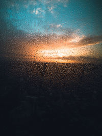 Full frame shot of raindrops on glass window