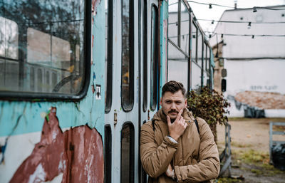 Portrait of young man in urban city 