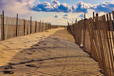 View of wooden fence on beach