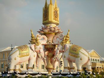 Statue against temple