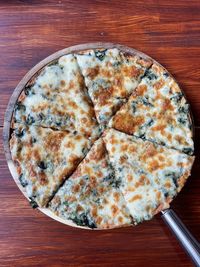 High angle view of pizza in plate on table