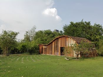 Built structure on field against sky