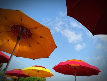 Low angle view of umbrella against sky