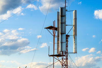 Low angle view of metallic structure against sky