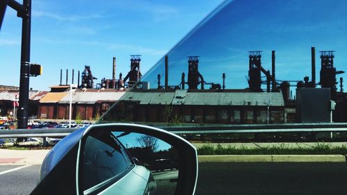 Cars on road against sky
