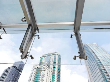 Low angle view of modern buildings against sky