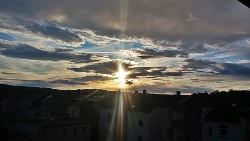 Sun shining through clouds