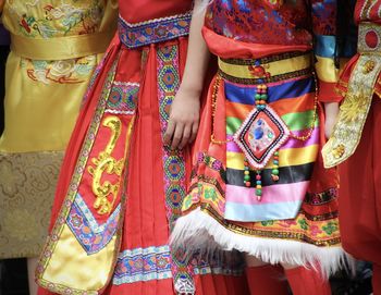 Midsection of woman wearing traditional clothing