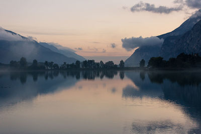 Scenic view of lake against sky during sunset