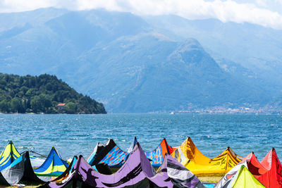 Scenic view of sea and mountains against sky