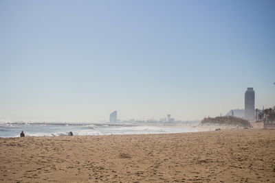 Scenic view of beach against clear sky