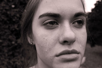 Close-up of sad young woman crying