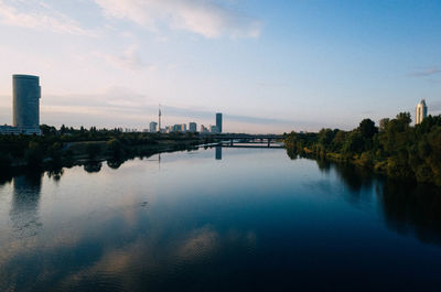 River in city against sky