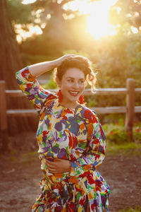 Portrait of smiling woman standing outdoors