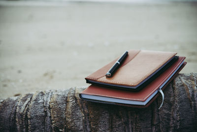 Close-up of books on sand