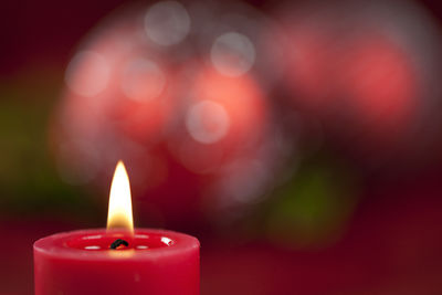 Close-up of burning red candle