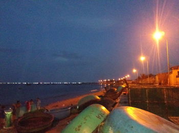 Panoramic shot of illuminated sea against sky