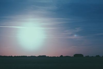 Scenic view of field against sky at night