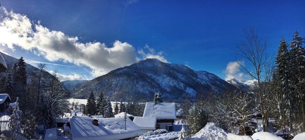 Scenic view of snow covered mountains against sky