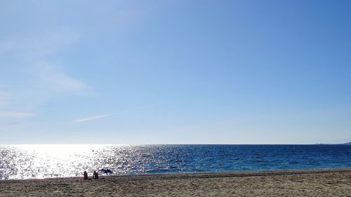 Scenic view of sea against blue sky