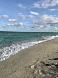 Scenic view of beach against sky