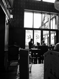 Rear view of man working at restaurant