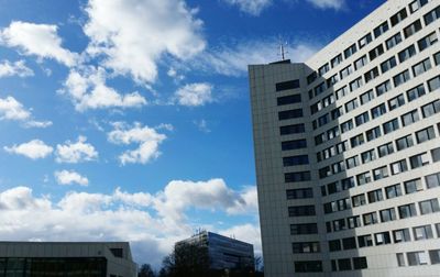 Low angle view of building against cloudy sky