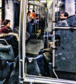 High angle view of people sitting in train