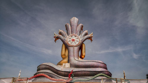 Low angle view of statue against sky