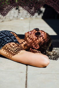 Woman lying poolside