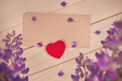 High angle view of heart shape on purple table