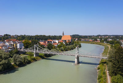 Germany, bavaria, drone view of salzach river and salzachbrucke connecting laufen and oberndorf